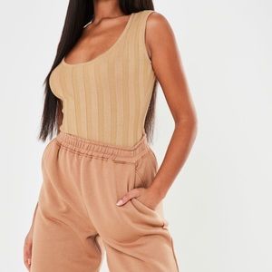 Misguided Ribbed Backless Tan Bodysuit size 2 .
